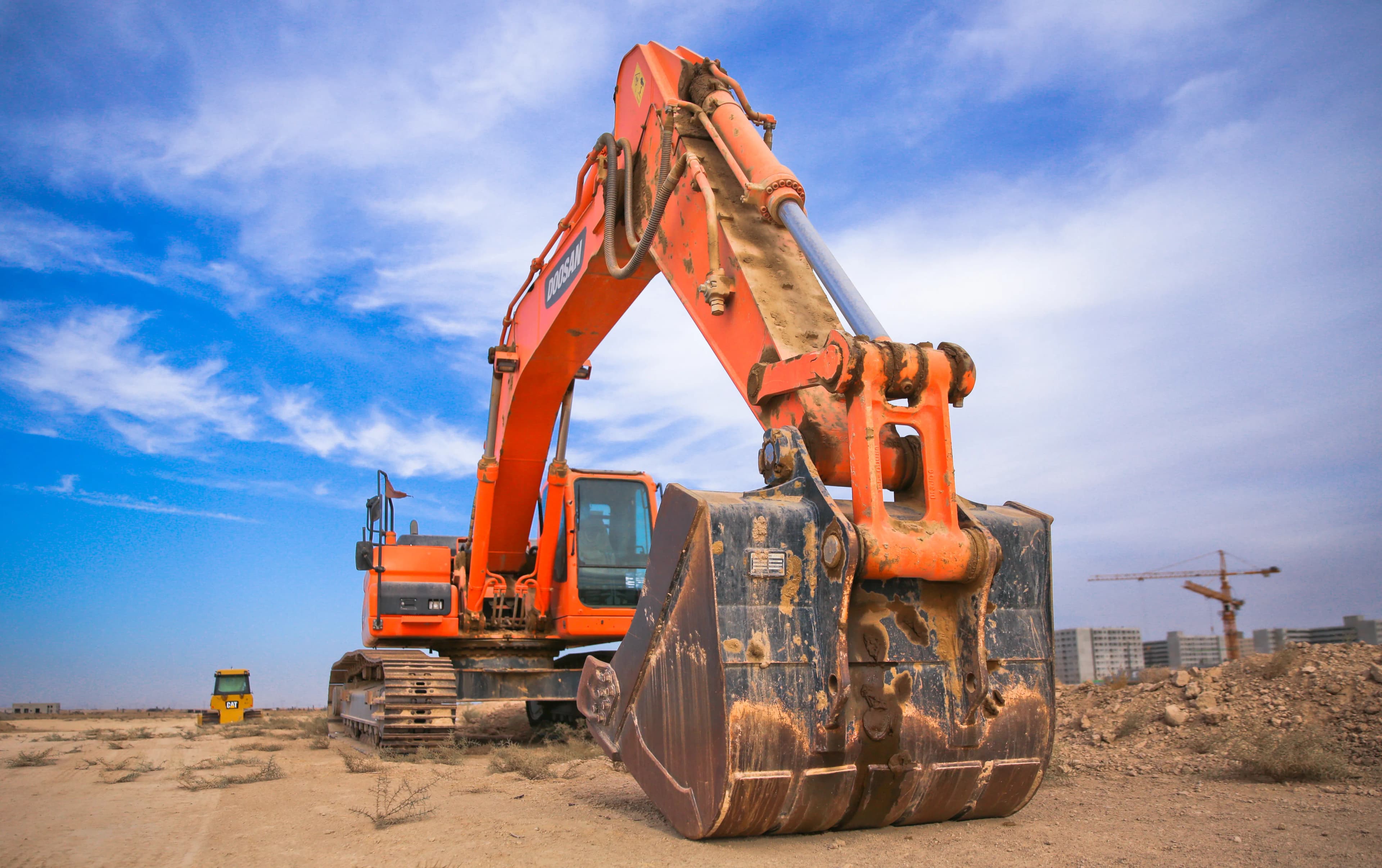 A mining excavator on a work site, representing the history of Vale and Brazilian iron ore mining
