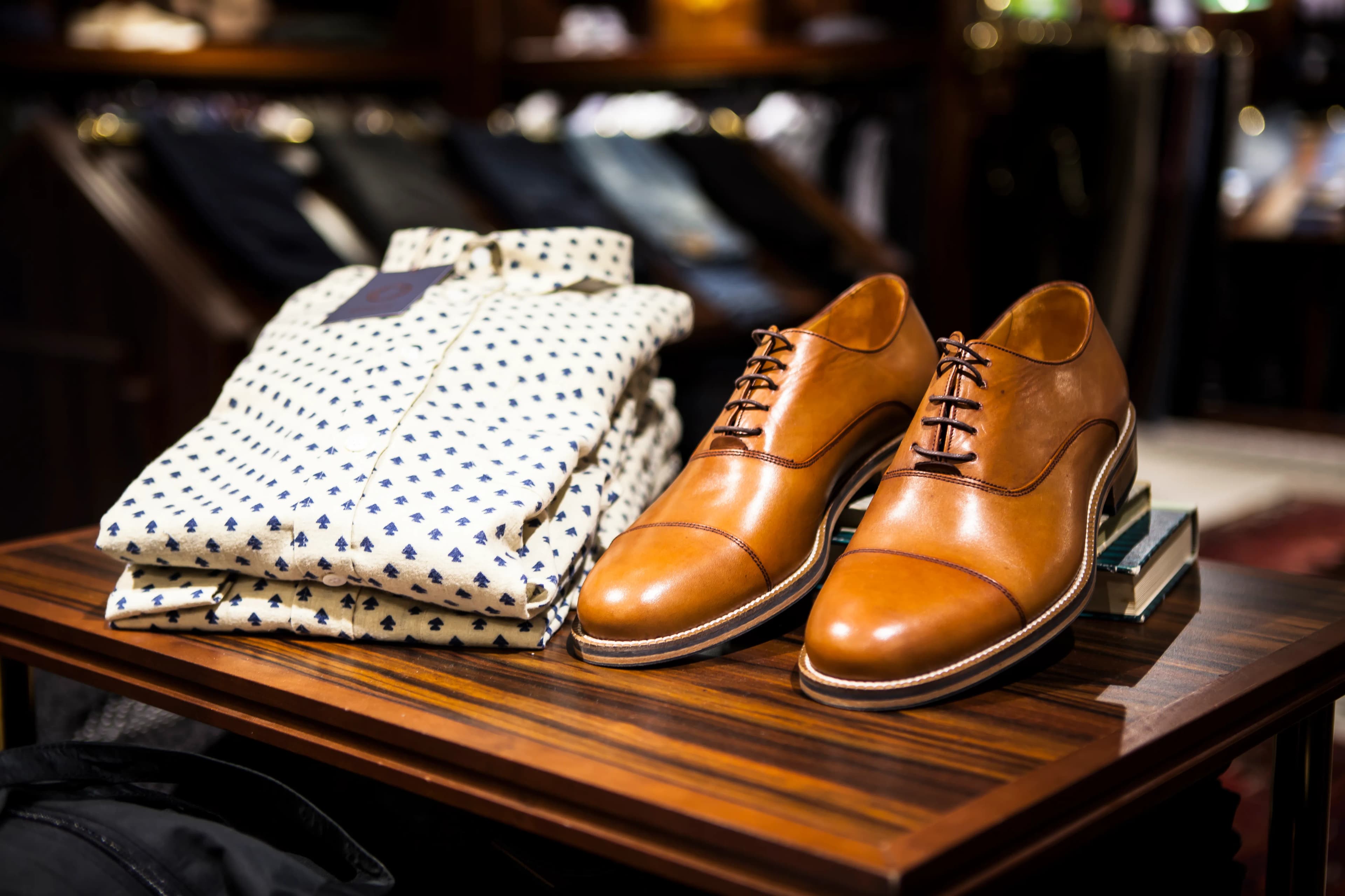 A retail store display of shoes and clothing, representing the consumer discretionary sector and XLY ETF