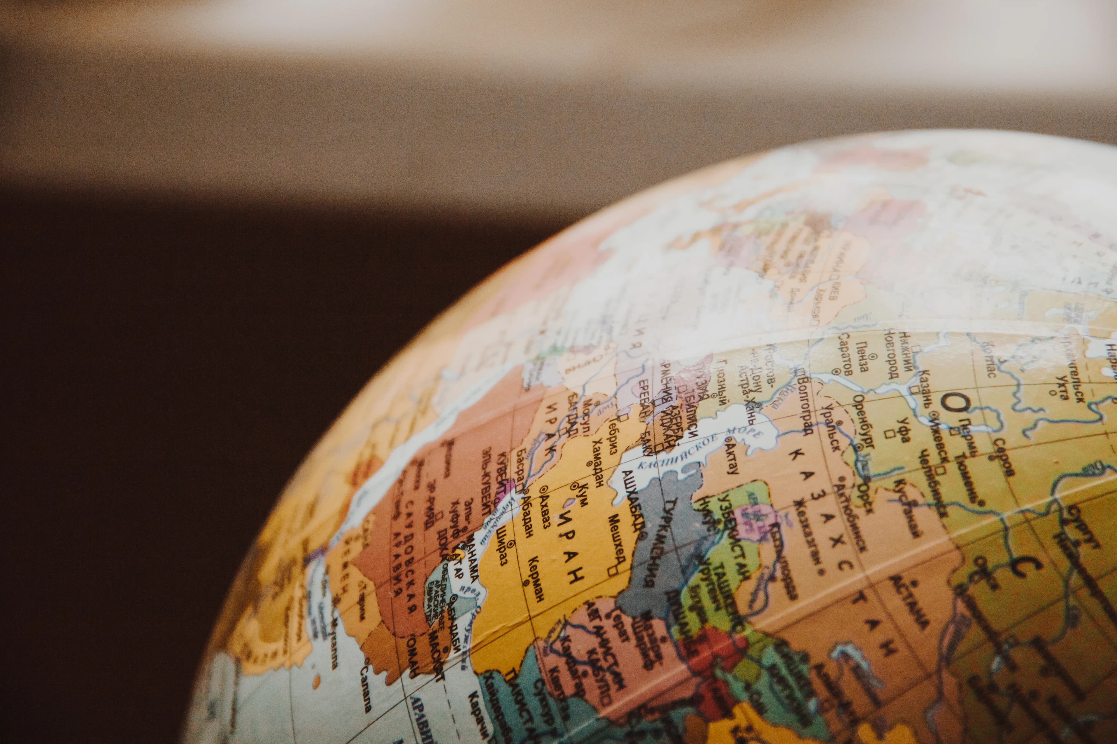 A world globe representing global stock markets across the US, Canada, Brazil and China