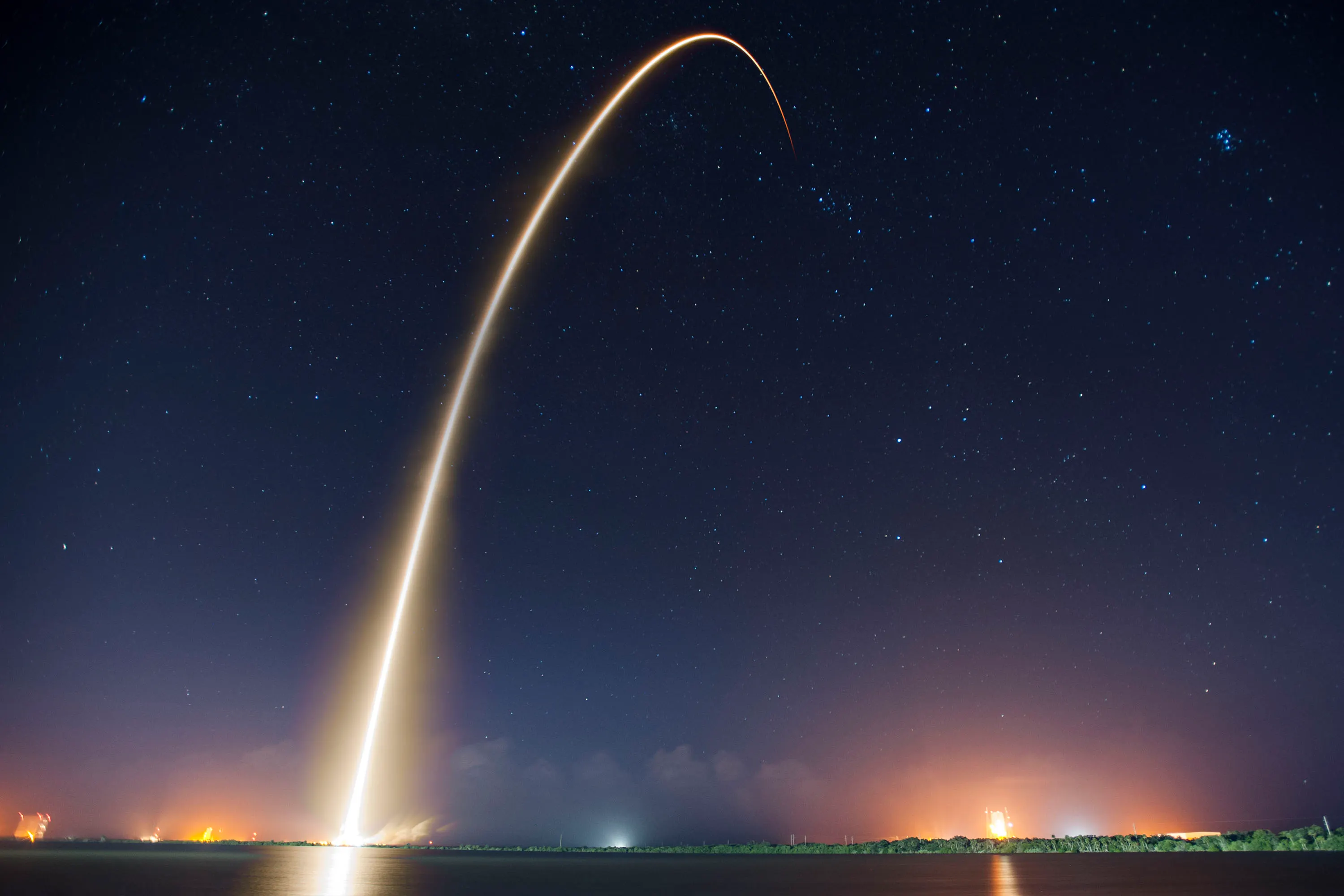 A rocket launching into space representing SpaceX Starship and Starlink