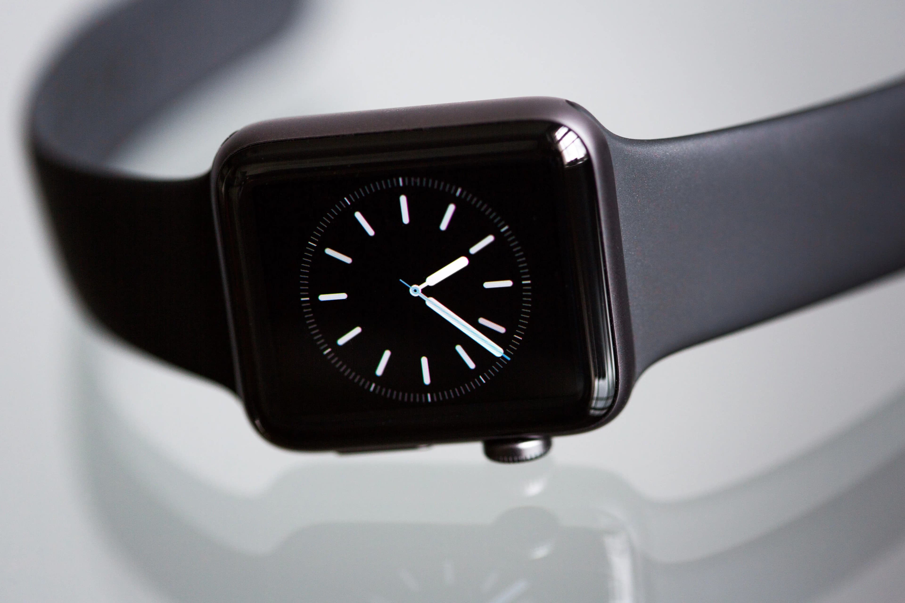 A smartwatch on a reflective surface, representing the Apple Watch Ultra 4 and its health features