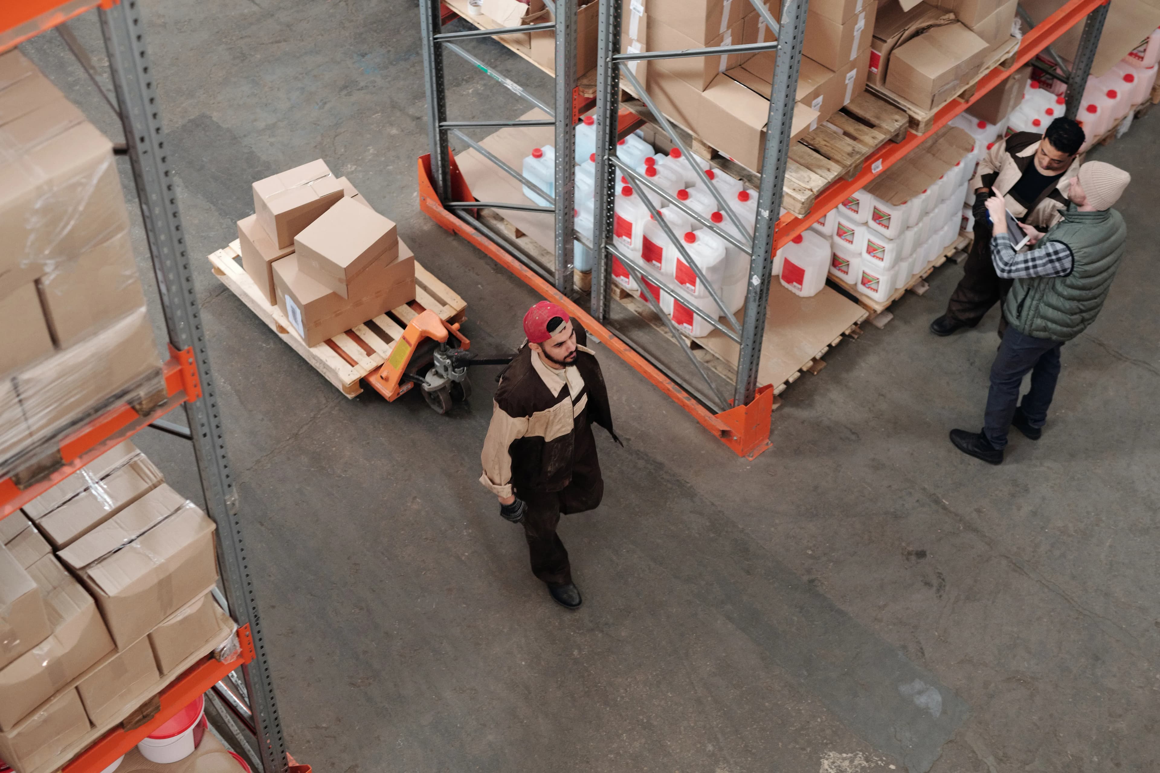 A logistics warehouse with boxes and shelving, representing the history of Amazon